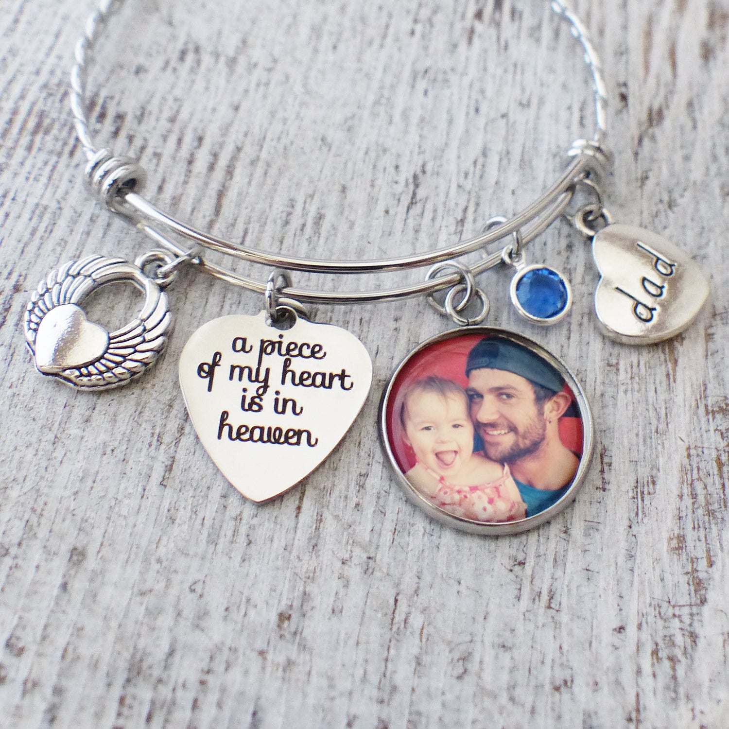 loss of a loved one memorial bangle bracelet with a piece of my heart is in heaven charm-an angel wing charm, dad charm, custom birthstone charm and custom photograph pendant