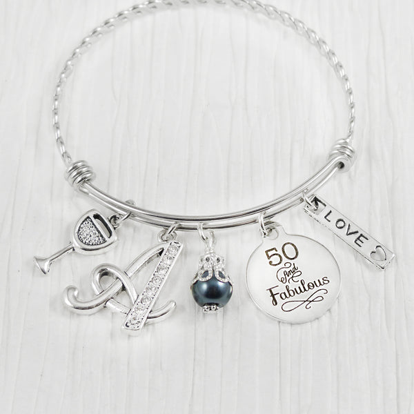 personalized 50 and fabulous bangle bracelet with rhinestone initial charm, and wine charm and love charm and grey colored bead for milestone birthday