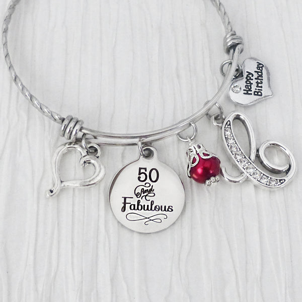 personalized 50 and fabulous bangle bracelet with heart charm, rhinestone initial charm, and heart shaped happy birthday charm with red bead