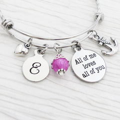 personalized bangle bracelet with round letter charm and all of me loves all of you charm with anchor charm and small heart charm and pink bead