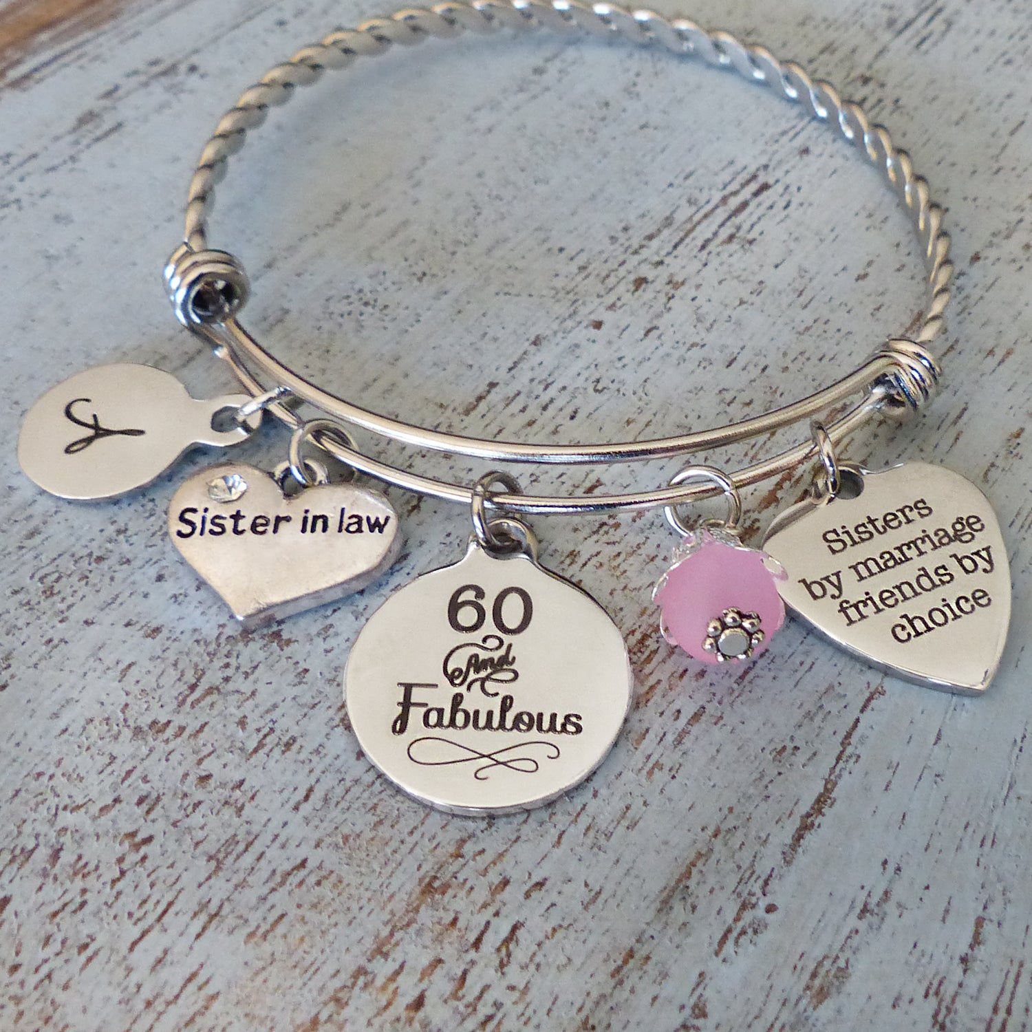 personalized sister in law bangle bracelet sisters by marriage friends by choice charm, round letter charm and pink bead with 60 and Fabulous charm